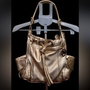 Michael Kors Metallic Gold Leather Drawstring Shoulder Bag.